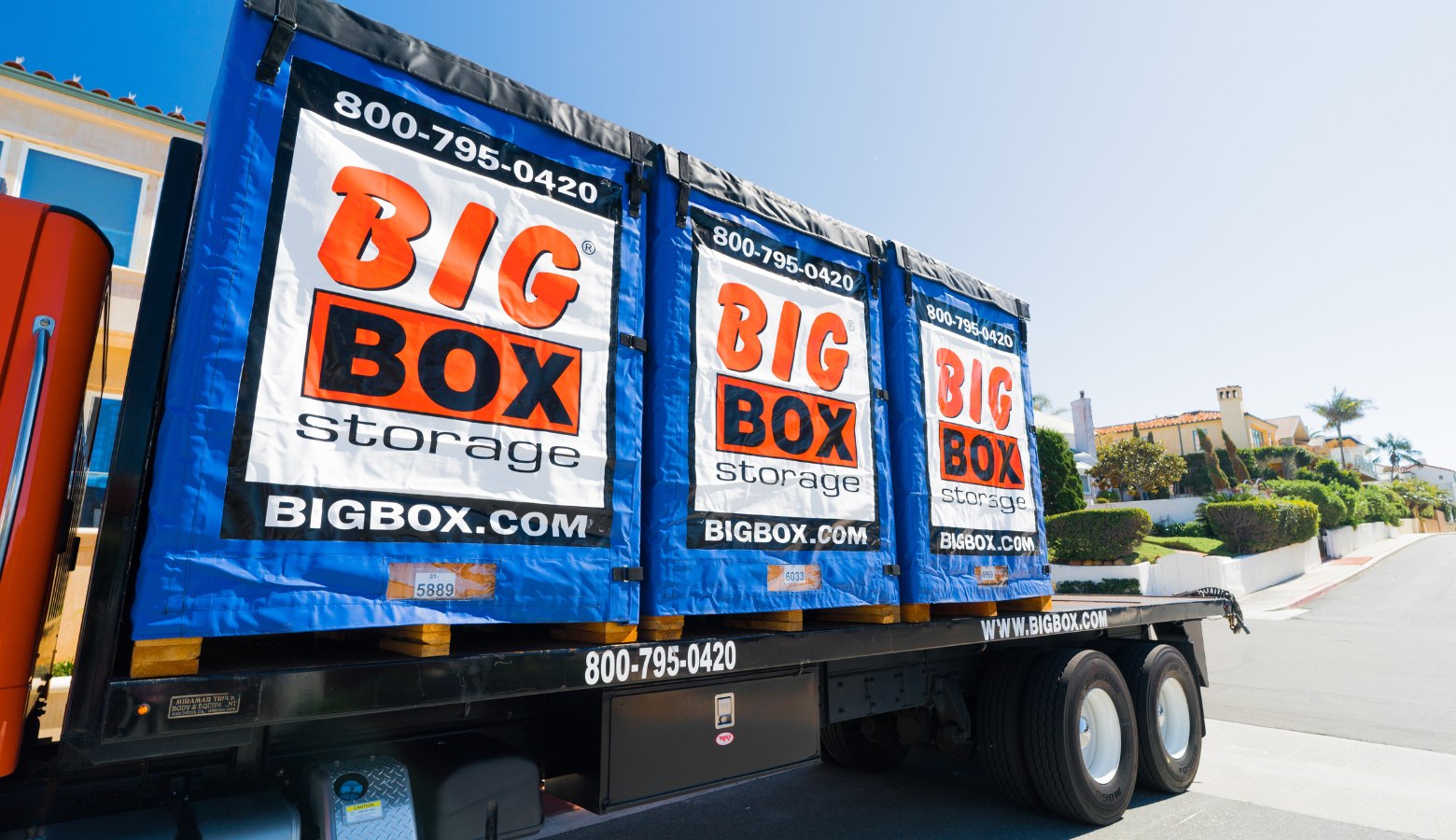 Portable storage truck carrying Big Box Storage storage units